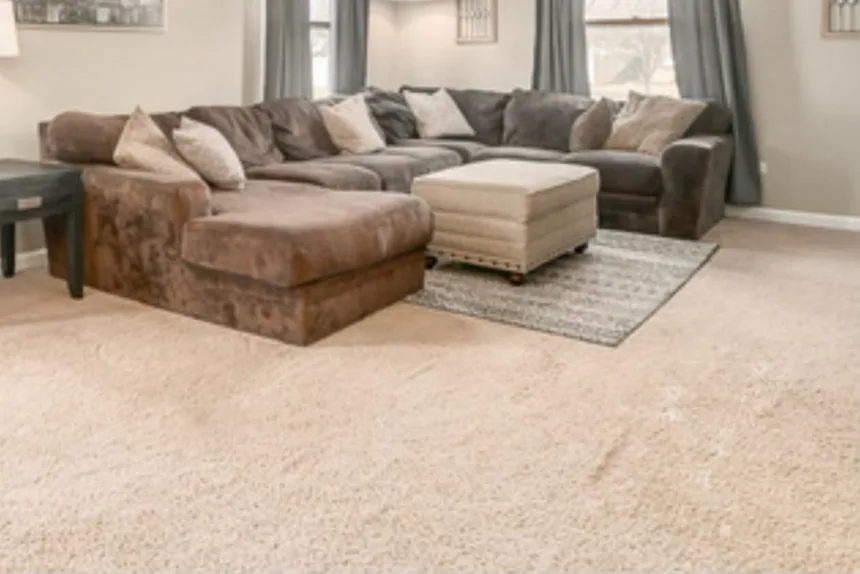 Large sectional sofa in living room before furniture removal by ONIT Junk Removal