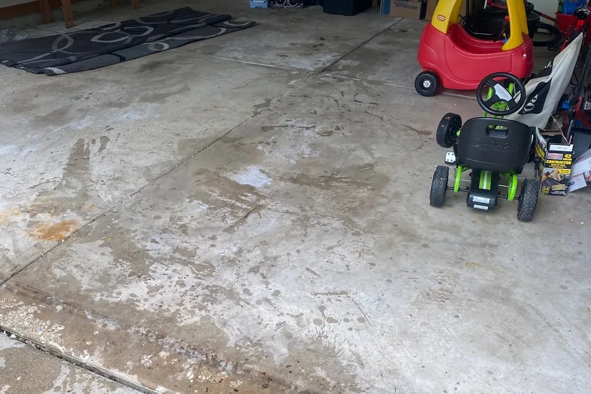 Cleared garage floor with shelving by ONIT Junk Removal