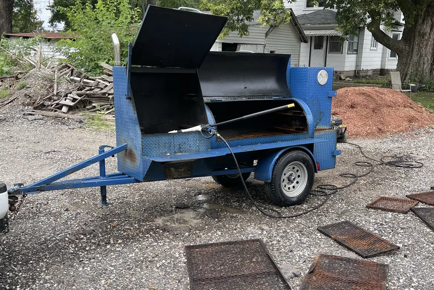 Old bbq smoker trailer and scrap grates before junk removal by ONIT Junk Removal