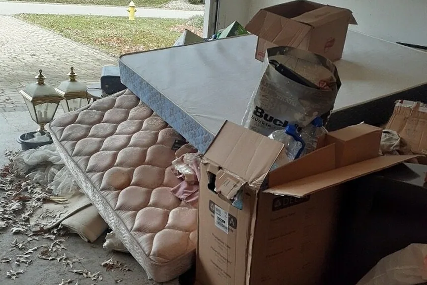 Mattresses and boxes in garage by ONIT Junk Removal