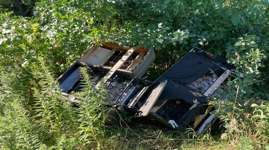Old couches hauled away during an Onit Junk Removal furniture removal job in Illinois